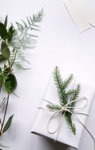 Simple Nordic Christmas gift wrapping with foliage