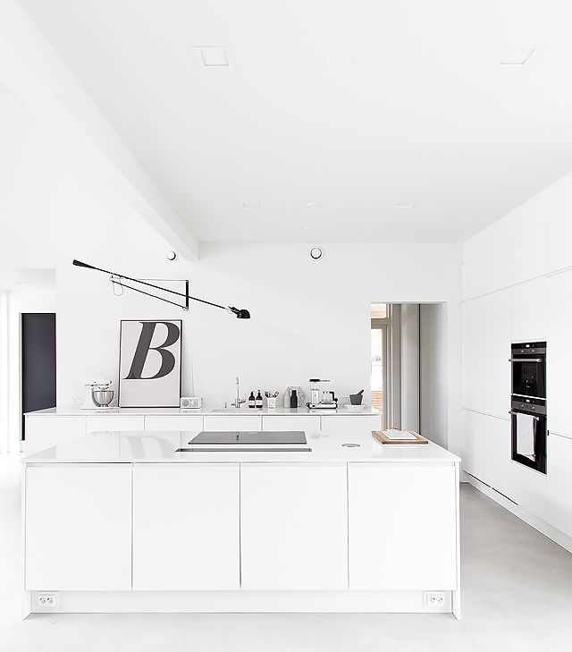 Black, white and concrete kitchen
