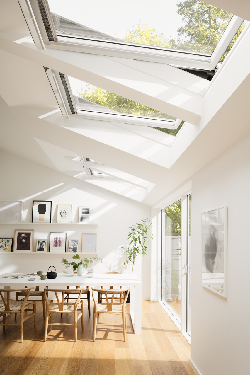 amazing white dining room with natural light with velux roof windows