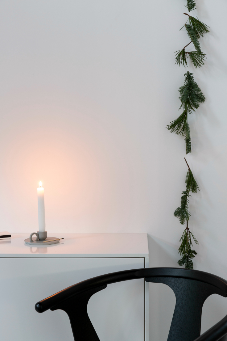 O candle holder in a Christmas setting
