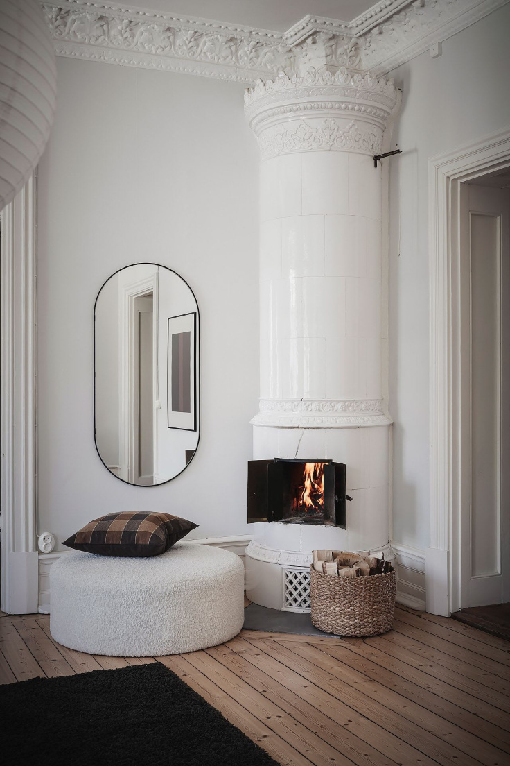 An original tiled fireplace stands as the perfect spot to cosy up in winter