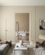 Trendy neutral colours in a Nordic living room with Scandinavian designer furniture and accessories