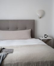 Neutral bedroom with tactile bouclé bolster cushion DIY.