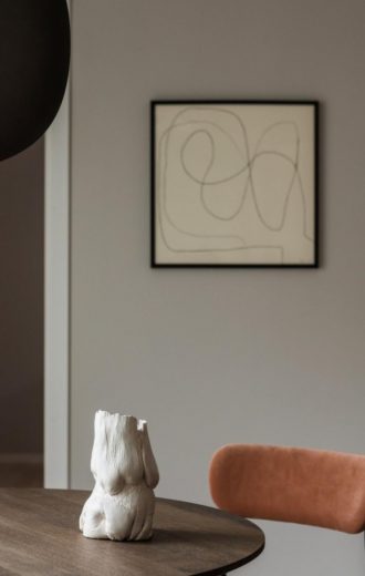 The perfect Stockholm apartment featuring beautiful ceramics and abstract art.