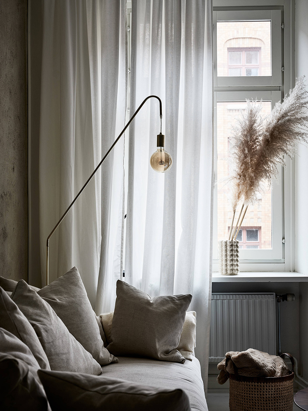 Moody Swedish apartment with Pampas grass as decor