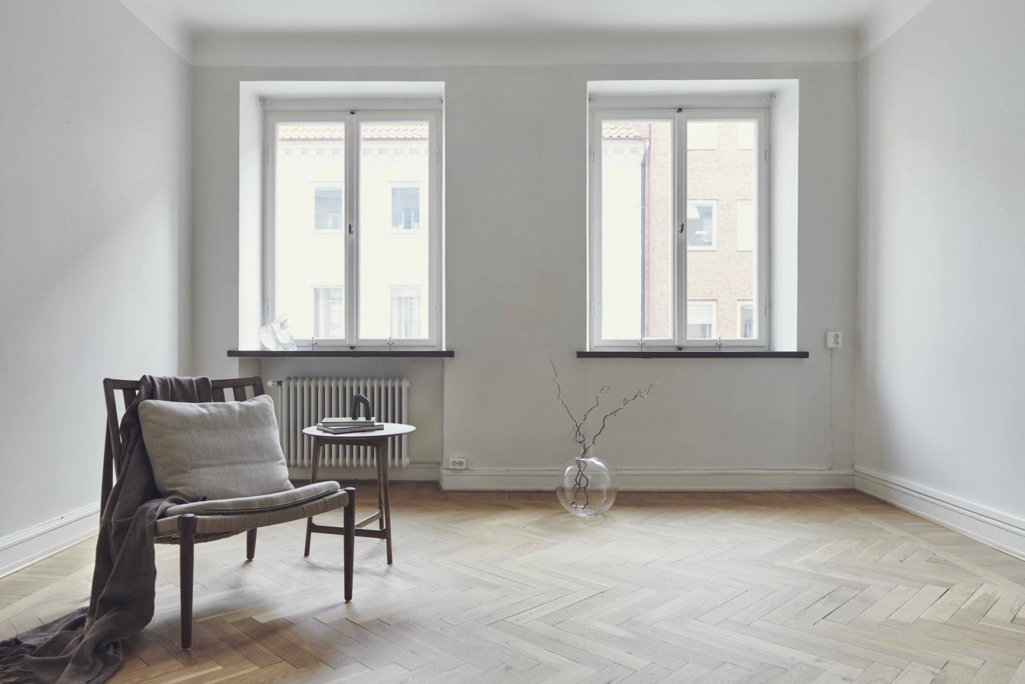 White Minimal Living Room with double Windows and herringbone flooring