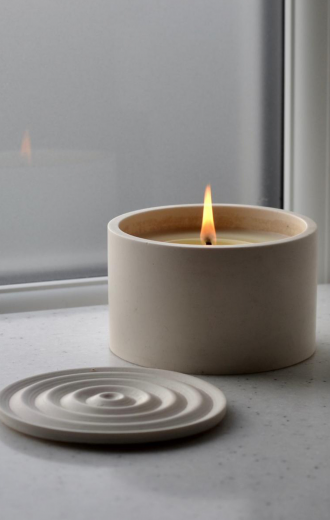 minimal soy wax candle in a beige Jesmonite container with lid