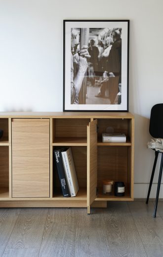 Sideboard with both hidden and visible storage options.