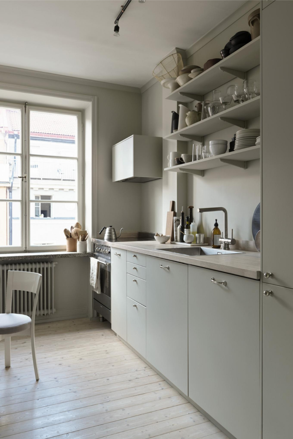 beige kitchen with natural wood counters and neutral muted tones